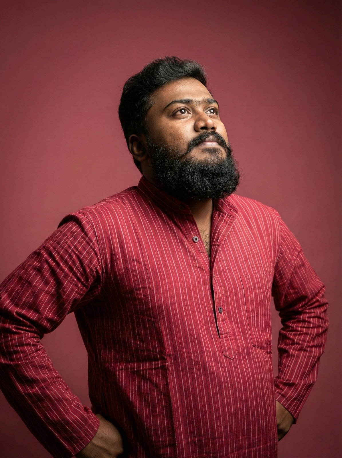 thrinadhsai author portrait in red kurta