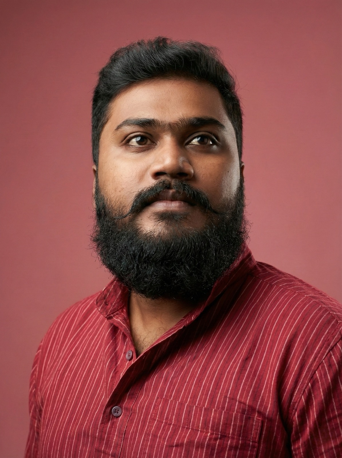 thrinadhsai close up author portrait in red kurta